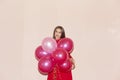 Attractive and young woman holds balloons. valentines day, birthday, womens day, anniversary, holiday celebration concept Royalty Free Stock Photo