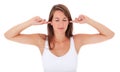 Attractive young woman keeps her ears shut Royalty Free Stock Photo