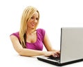 Attractive young woman with a laptop sitting at the desk Royalty Free Stock Photo