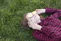 Girl wearing cool glasses laying on green grass Royalty Free Stock Photo