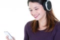 Attractive young woman listening to music on her mobile Royalty Free Stock Photo