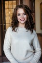 Attractive young woman with long curly hair