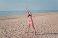 Attractive young woman making yoga on the beach Royalty Free Stock Photo