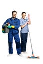 Attractive young woman and man in cleaning uniform and rubber gloves holding a broom cleaning products in his hands, isolated on Royalty Free Stock Photo