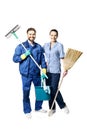 Attractive young woman and man in cleaning uniform and rubber gloves holding a broom cleaning products in his hands, isolated on Royalty Free Stock Photo