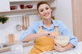 attractive young woman mixing dough for pastry