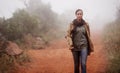 Another misty morning meander. An attractive young woman out for a walk in the mountains. Royalty Free Stock Photo