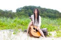 Attractive Young Woman Outdoors With Guitar Royalty Free Stock Photo