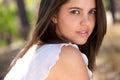 Attractive young woman posing outside in forest