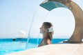 Attractive young woman refresh in pool Royalty Free Stock Photo