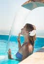 Attractive young woman refresh in pool Royalty Free Stock Photo