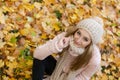 Attractive young woman relaxing in atumn park outdoor Royalty Free Stock Photo