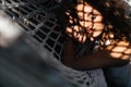 Attractive young woman is relaxing outdoor while lying in hammock. Royalty Free Stock Photo