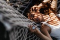 Attractive young woman is relaxing outdoor while lying in hammock. Royalty Free Stock Photo