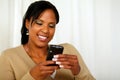 Attractive young woman sending a text message Royalty Free Stock Photo