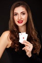 Attractive young woman holding the winning combination of poker cards Royalty Free Stock Photo