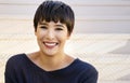 Attractive young woman with short stylish hair friendly smile Royalty Free Stock Photo