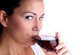 Attractive young woman sipping wine