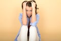 Attractive Young Woman Sitting on the Floor Wearing a Blue Shirt Royalty Free Stock Photo