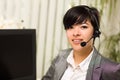 Attractive Young Woman Smiles Wearing Headset Royalty Free Stock Photo