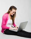 Attractive young woman smiling with laptop Royalty Free Stock Photo