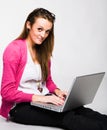 Attractive young woman smiling with laptop