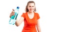 Attractive young woman smiling and offering bottle of water Royalty Free Stock Photo