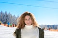 Attractive young woman in a snowy winter landscape Royalty Free Stock Photo