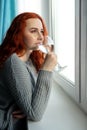 Attractive young woman drinking water at home Royalty Free Stock Photo