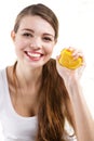 Attractive young woman squeezing and orange Royalty Free Stock Photo