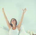 Attractive young woman stretching in bed after waking up Royalty Free Stock Photo