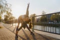 Attractive young woman stretching her arms and legs before her early morning exercise Royalty Free Stock Photo