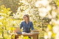 attractive young woman using laptop outside. Royalty Free Stock Photo