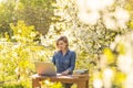 attractive young woman using laptop outside. Royalty Free Stock Photo