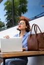 attractive young woman using laptop outside Royalty Free Stock Photo