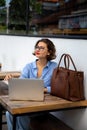 attractive young woman using laptop outside Royalty Free Stock Photo