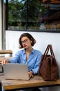 attractive young woman using laptop outside Royalty Free Stock Photo