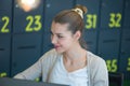 Attractive young woman using laptop while sitting at her desk. Young american businesswoman sitting in the office and working on Royalty Free Stock Photo