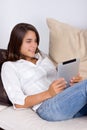 Attractive young woman using a tablet computer Royalty Free Stock Photo