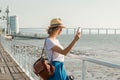 Attractive young woman walking in Lisbon near Tajus river at Park of the Nations Royalty Free Stock Photo