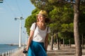 Attractive young woman walking in Lisbon near Tajus river at Park of the Nations Royalty Free Stock Photo