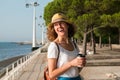 Attractive young woman walking in Lisbon near Tajus river at Park of the Nations Royalty Free Stock Photo
