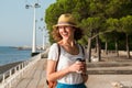 Attractive young woman walking in Lisbon near Tajus river at Park of the Nations Royalty Free Stock Photo