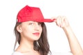 Attractive young woman wearing a red baseball cap Royalty Free Stock Photo