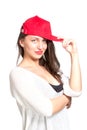 Attractive young woman wearing a red baseball cap Royalty Free Stock Photo