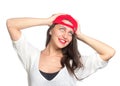 Attractive young woman wearing a red baseball cap Royalty Free Stock Photo