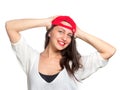 Attractive young woman wearing a red baseball cap Royalty Free Stock Photo