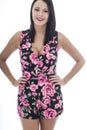 Attractive Young Woman Wearing a Short Floral Playsuit Royalty Free Stock Photo