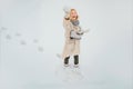 Attractive young woman in wintertime outdoor. Funny young woman in the winter time. Wearing funny hat plaid scarf and Royalty Free Stock Photo