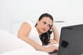 Attractive young woman working on her laptop at home Royalty Free Stock Photo